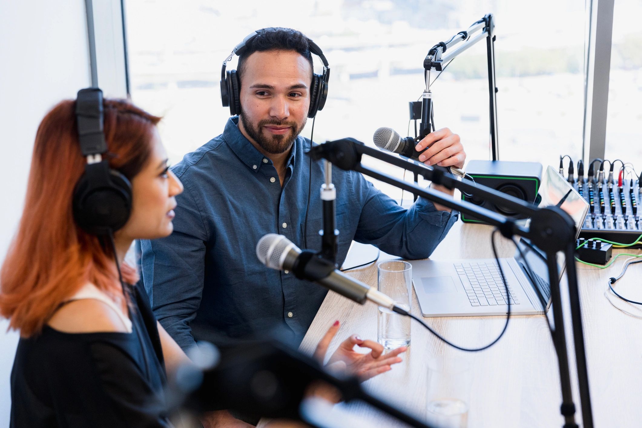 sports hosts recording podcast